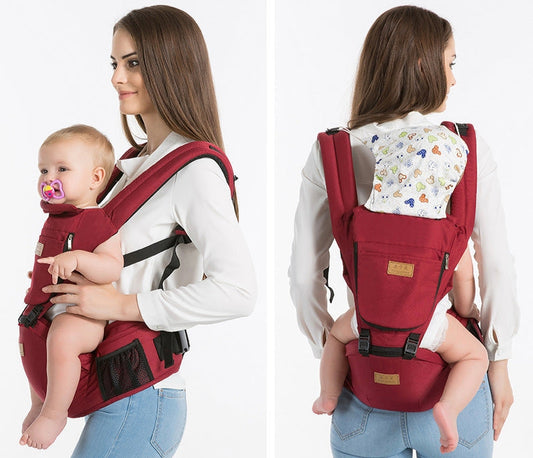 Mom wearing black ergonomic baby hip carrier with newborn — adjustable sling carrier from Zedi Trends